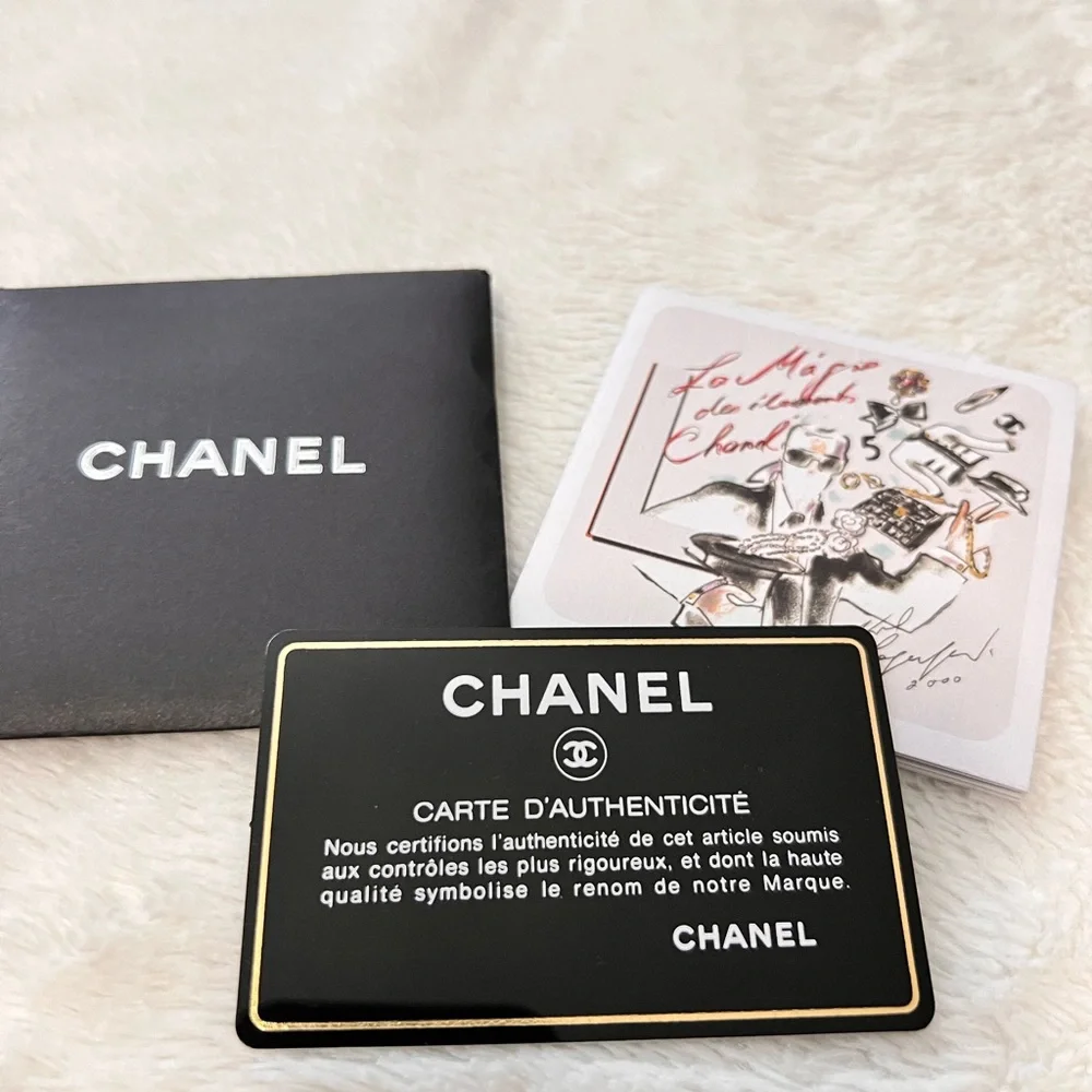 CHANEL Black Quilted Leather Shoulder Tote with White CC Emblem